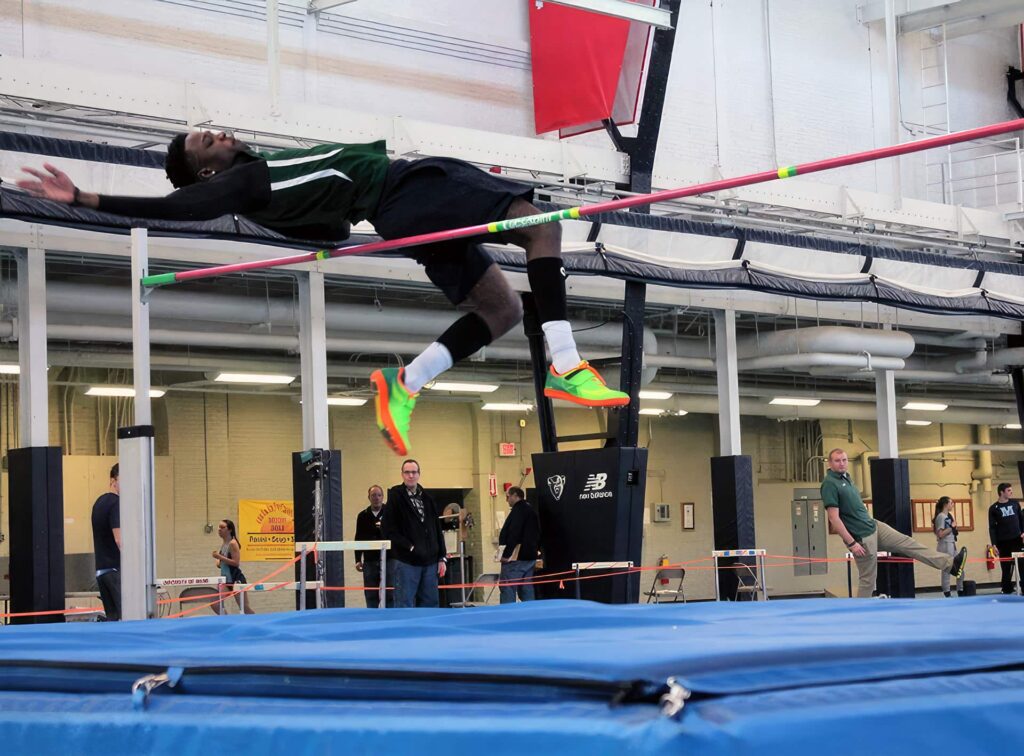 Ajay Thompson clears the bar in Orono, Maine.