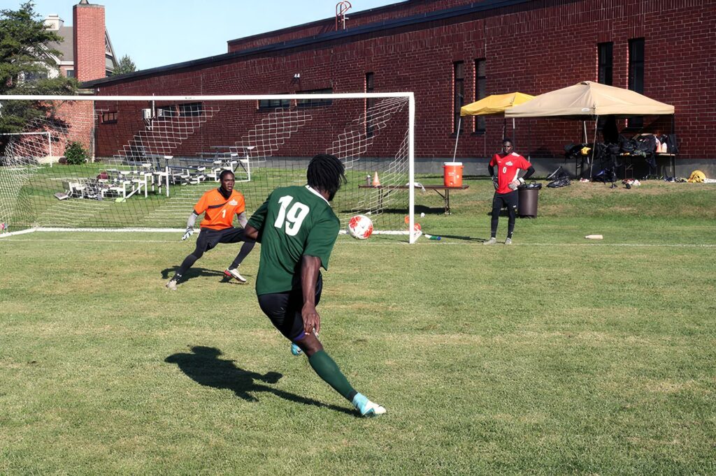 Men's Soccer players practice at the Sports Center, patiently waiting until it is their time to run the marathon again.