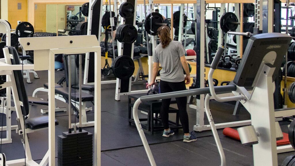 a female student works out at the UMFK Sports Center